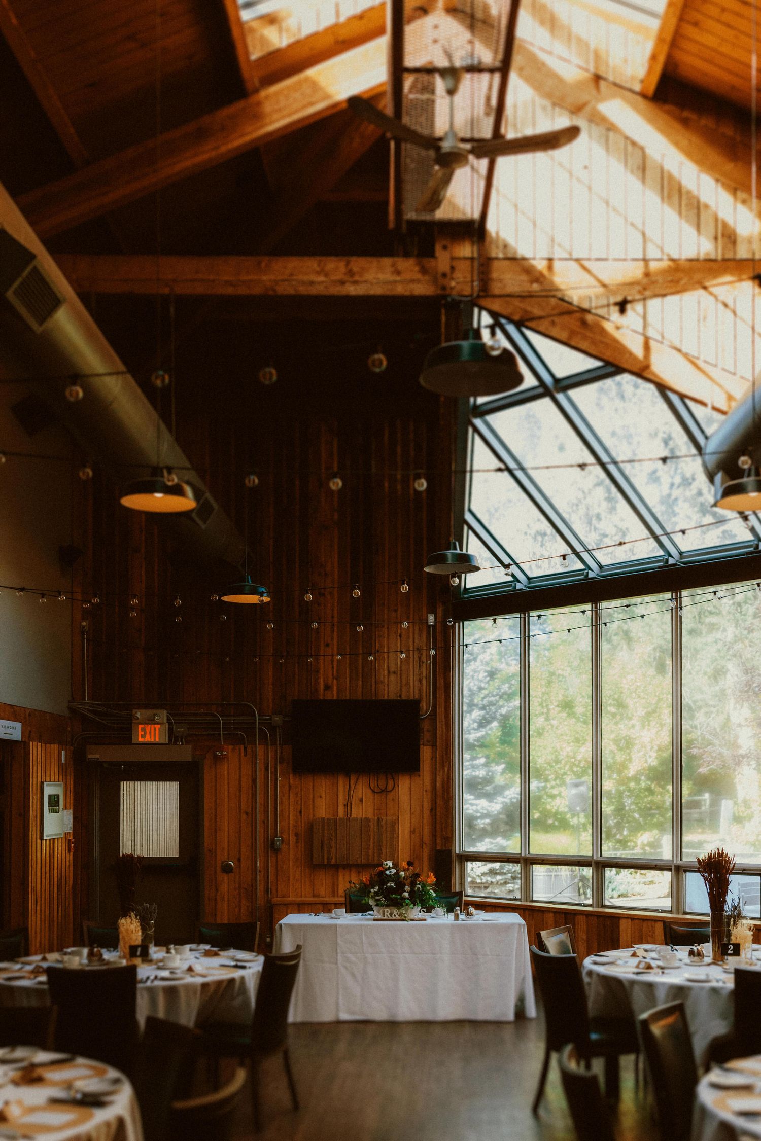 Rustic-chic wedding décor at Calgary Zoo reception, beautifully documented by a Calgary wedding photographer.