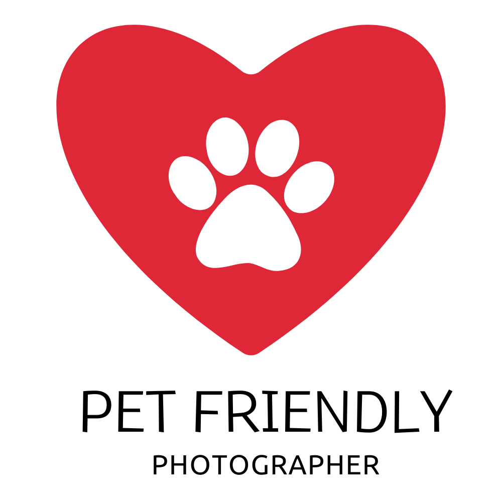 Red heart with white paw print design on black background representing pet-friendly spaces.