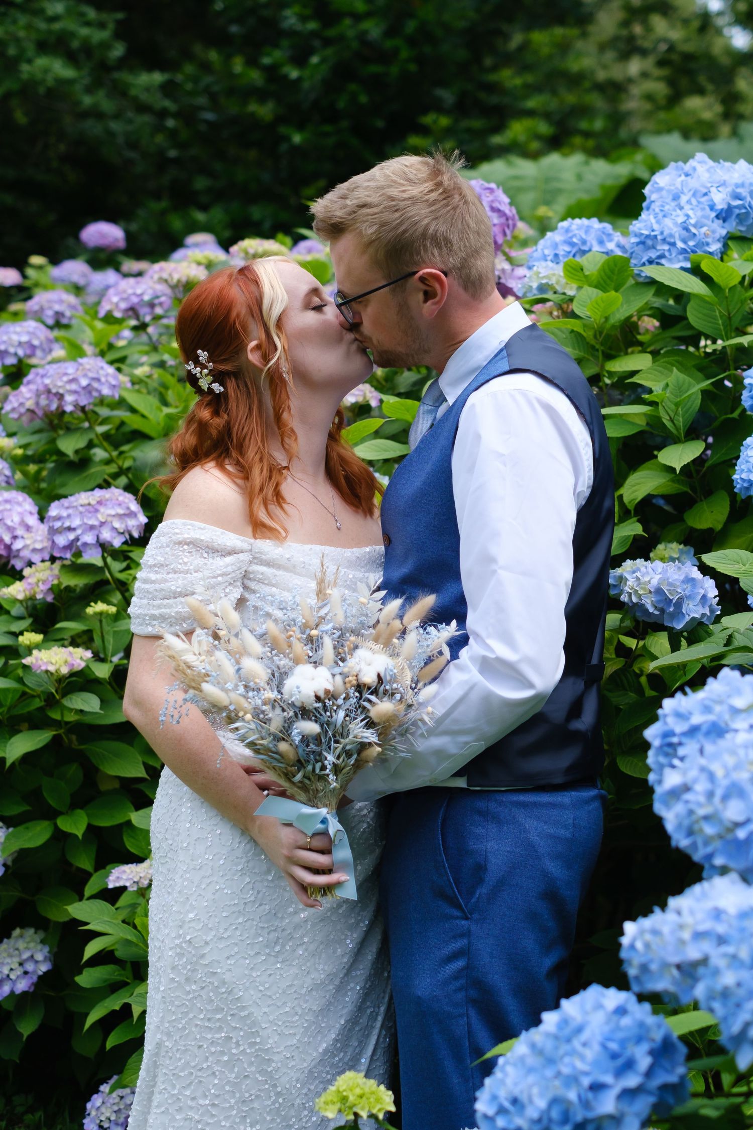 Bride and Groom sharing a kiss in the grounds of Merewood Country House Hotel