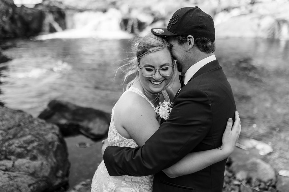 Black and white romantic wedding photography collage showing intimate moments between newlyweds outdoors.