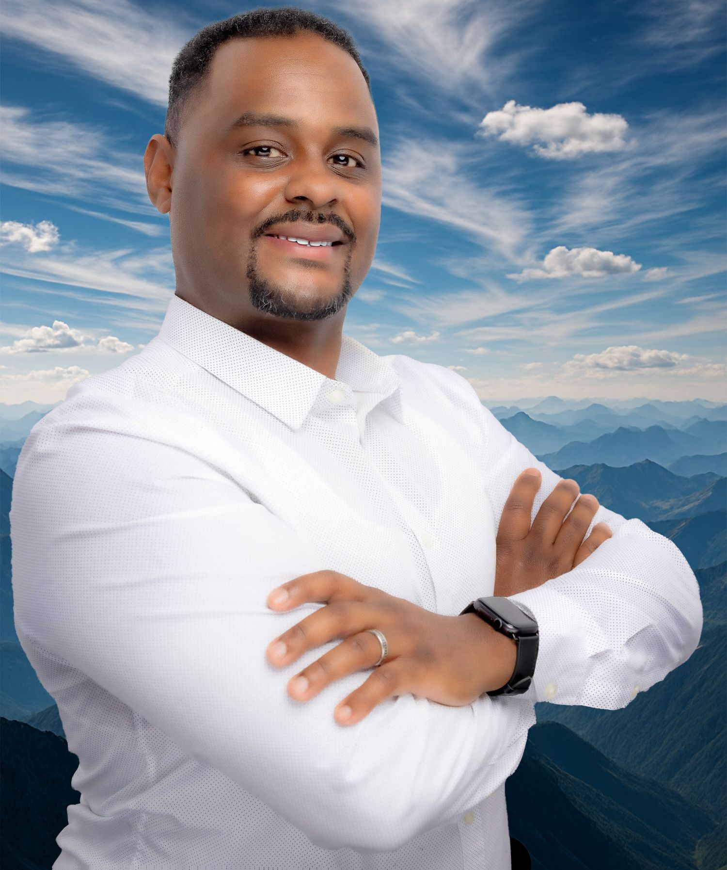 Portrait of Hedley Wilson, owner of Wilson Photography Services in Alpharetta, GA, smiling confidently in a white shirt against.