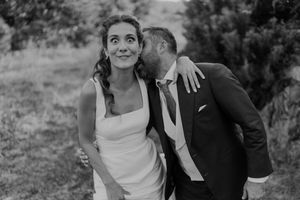Bride and groom walking through the gardens of The Astoria — emotional portrait with golden light in Porto