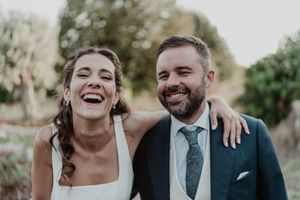 Bride and groom walking through the gardens of The Astoria — emotional portrait with golden light in Porto