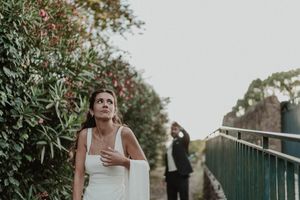 Bride and groom walking through the gardens of The Astoria — emotional portrait with golden light in Porto