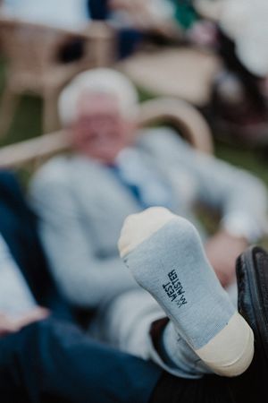 A close-up shot of a groom´s father during cocktail at The Astoria