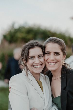 Candid moment during cocktail hour at The Astoria — guests laughing and mingling in the garden