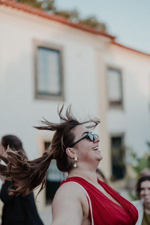 Guest dancing with a drink in hand before dinner — cocktail chaos at The Astoria wedding party