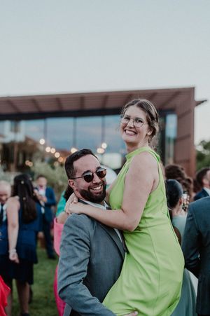 Candid moment during cocktail hour at The Astoria — guests laughing and mingling in the garden