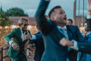 Guests celebrate enthusiastically outdoors at a wedding event - The Astoria, Grijó