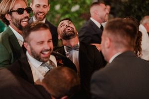 Guests lifting the groom in the air during the party — wild wedding moment at The Astoria in Porto