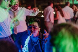 Candid dance floor moment at a boho-inspired wedding party in Porto