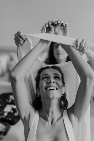 Candid prep shot of bridesmaids celebrating — alternative wedding energy at The Astoria venue in Portugal.