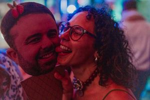 Two people share a joyful intimate moment together at a wedding party at The AStoria, Grijó
