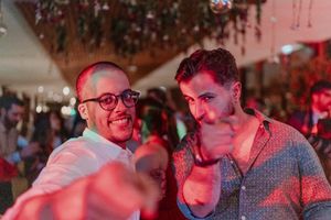 Candid dance floor moment at a boho-inspired wedding party in Porto