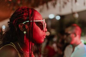 Woman dancing with eyes locked on her partner — intimate storytelling through movement