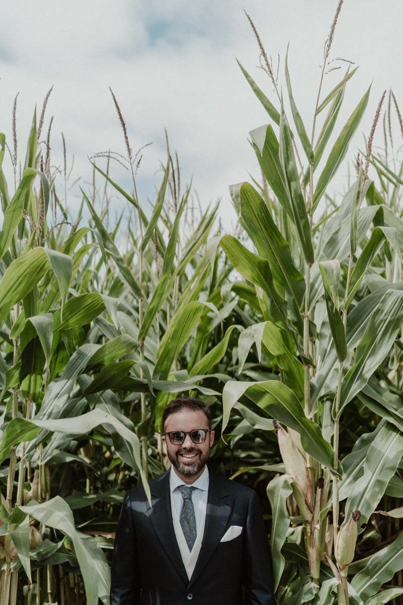 Groom portrait among the cornfields — boho-inspired destination wedding at The Astoria by Portugal wedding photographer.