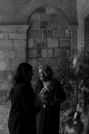 Cinematic silhouette of couple walking hand in hand during golden hour — Portugal wedding videographers capturing emotion.