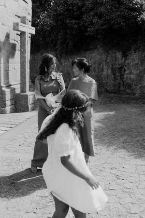 Spontaneous moment of bride and groom running together — fun storytelling wedding photo in the gardens of The Astoria.
