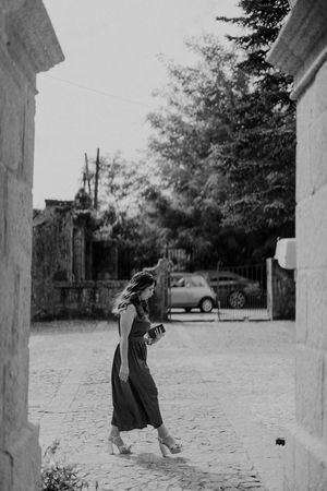 A black and white photograph by a documentary wedding moment at the church