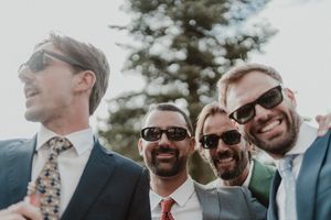 Bride and groom taking a selfie with friends — spontaneous wedding moments during cocktail at The Astoria by Histórias com Alma.