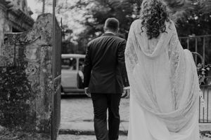 Couple walking through the gardens of The Astoria — intimate wedding photography with documentary style in Portugal.