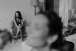 Candid bridesmaids chatting and relaxing before the wedding — spontaneous behind-the-scenes documentary photo at The Astoria.