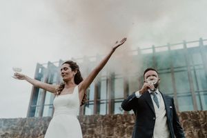 Bride and groom cutting the wedding cake together — emotional and fun moment at The Astoria
