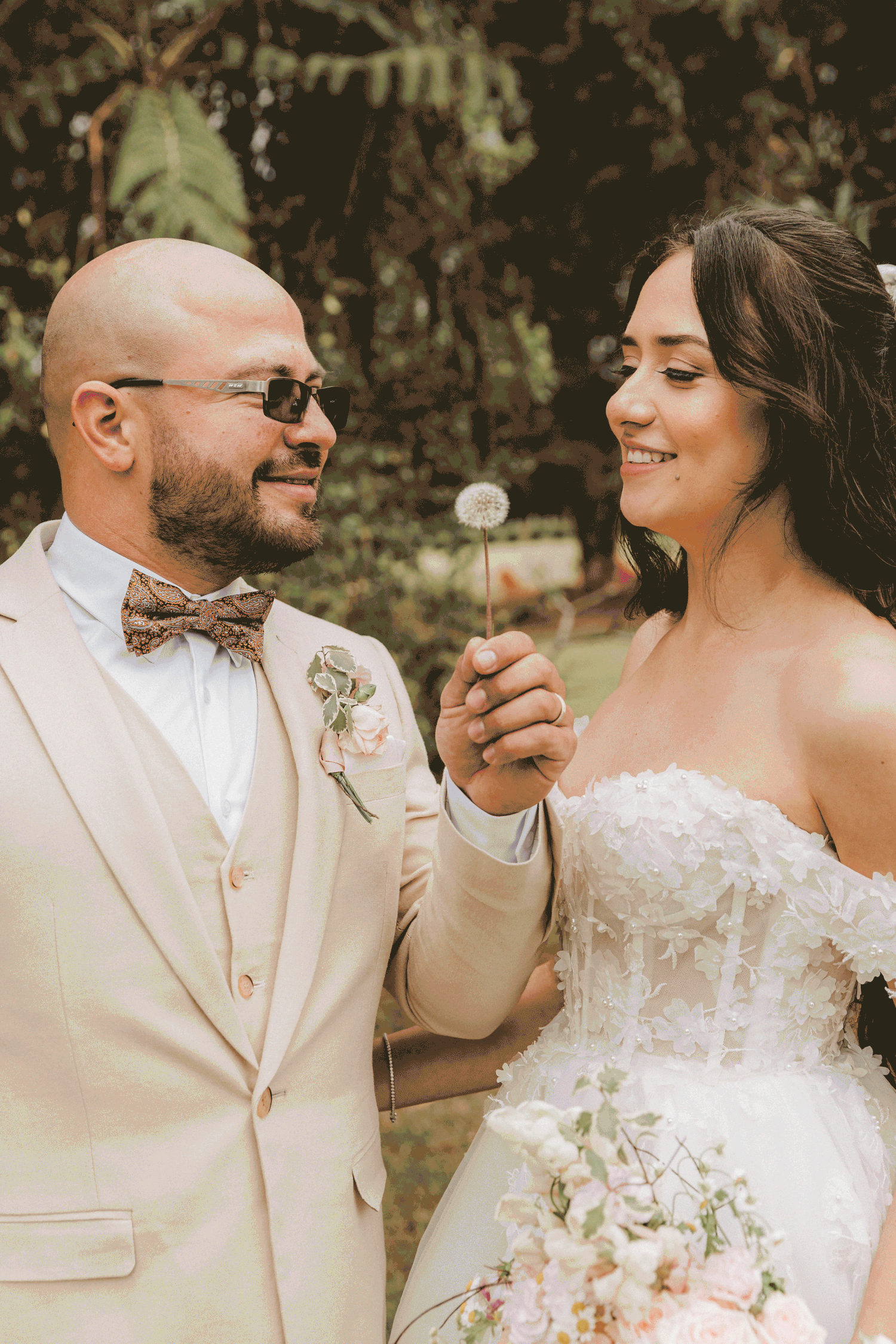A reception toast moment captured at a beautiful bayside wedding venue surrounded by glass windows and natural light.