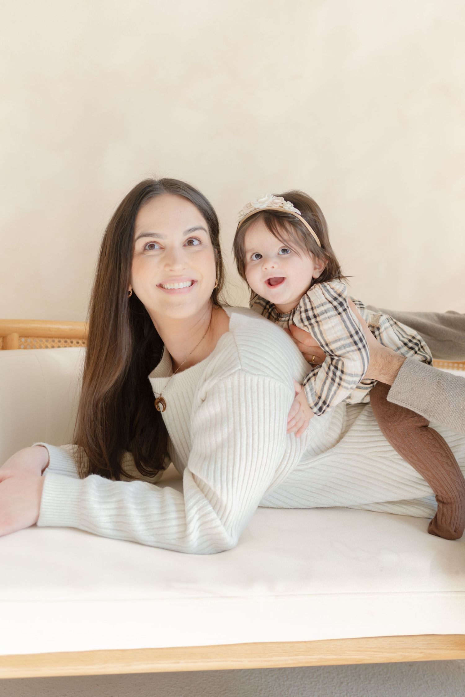 Mom and baby on couch at Toronto Photo studio Mint Room Studios for a mother's day photoshoot (mommy and me photos)