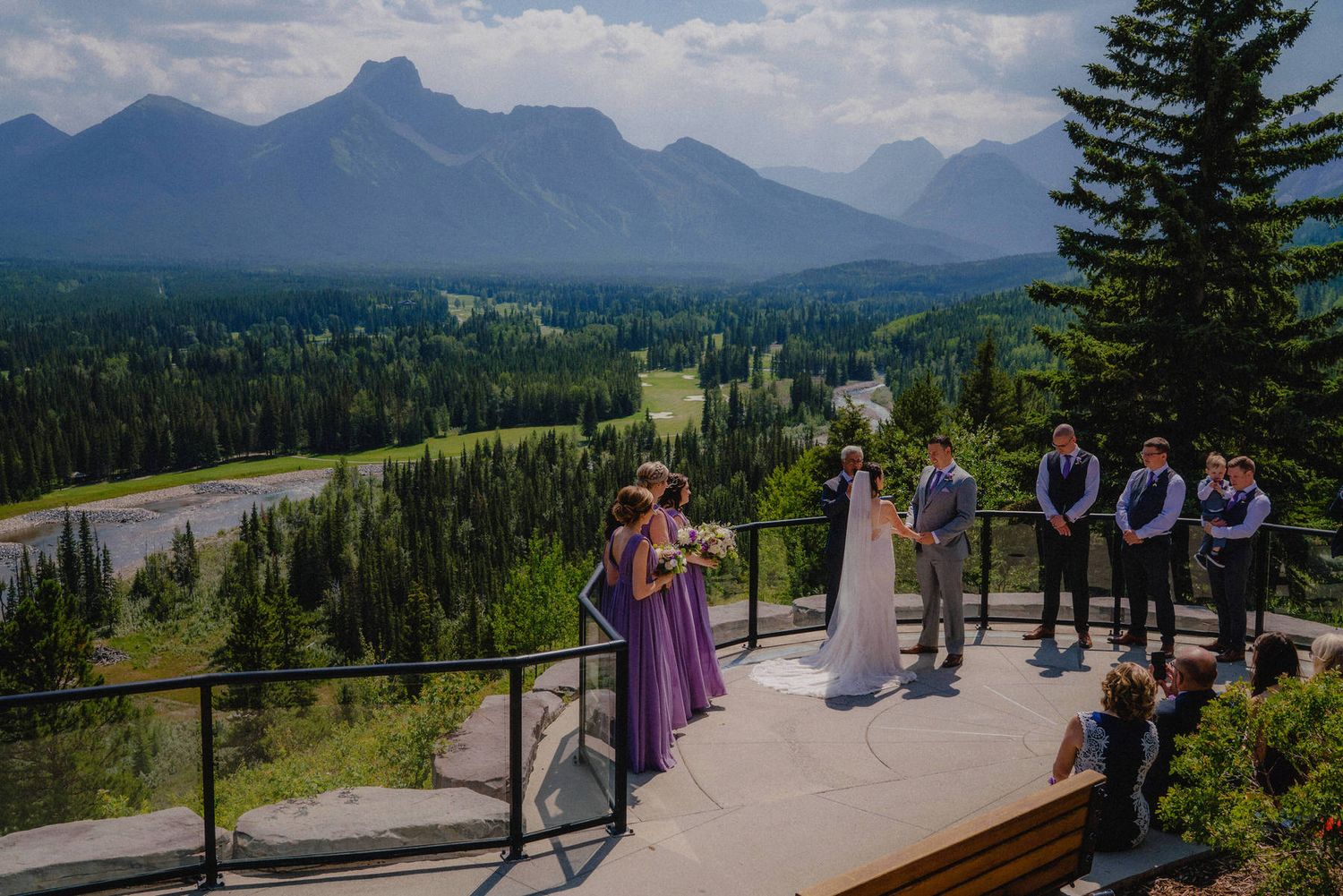 Mountain view wedding ceremony at Pomeroy Kananaskis Mountain Lodge, captured by Calgary wedding photographer in the Rockies.