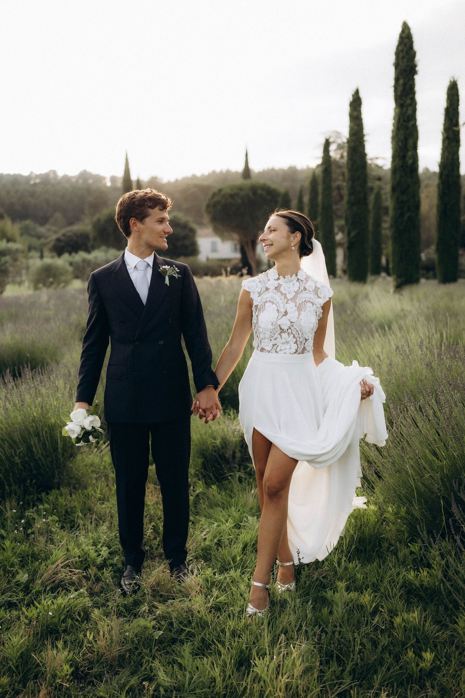 A tender autumn embrace captured during a wedding photoshoot with fall foliage.