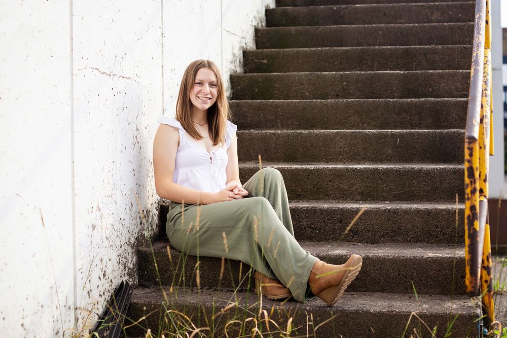 A person in olive pants and brown boots sits on concrete steps at different angles in a photo collage.