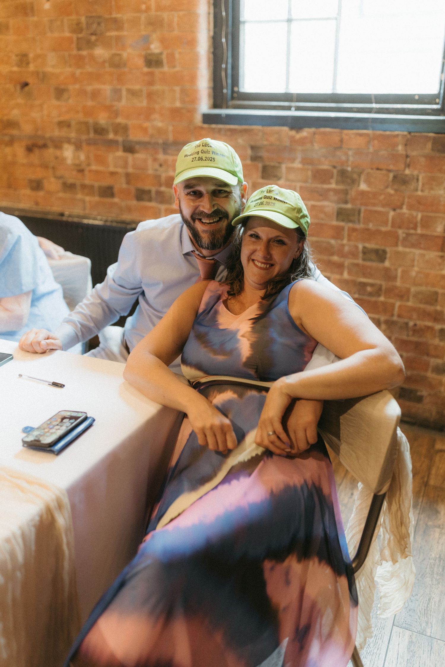 Three casual photos capture people lounging in a sunlit room with exposed brick walls and cozy seating.