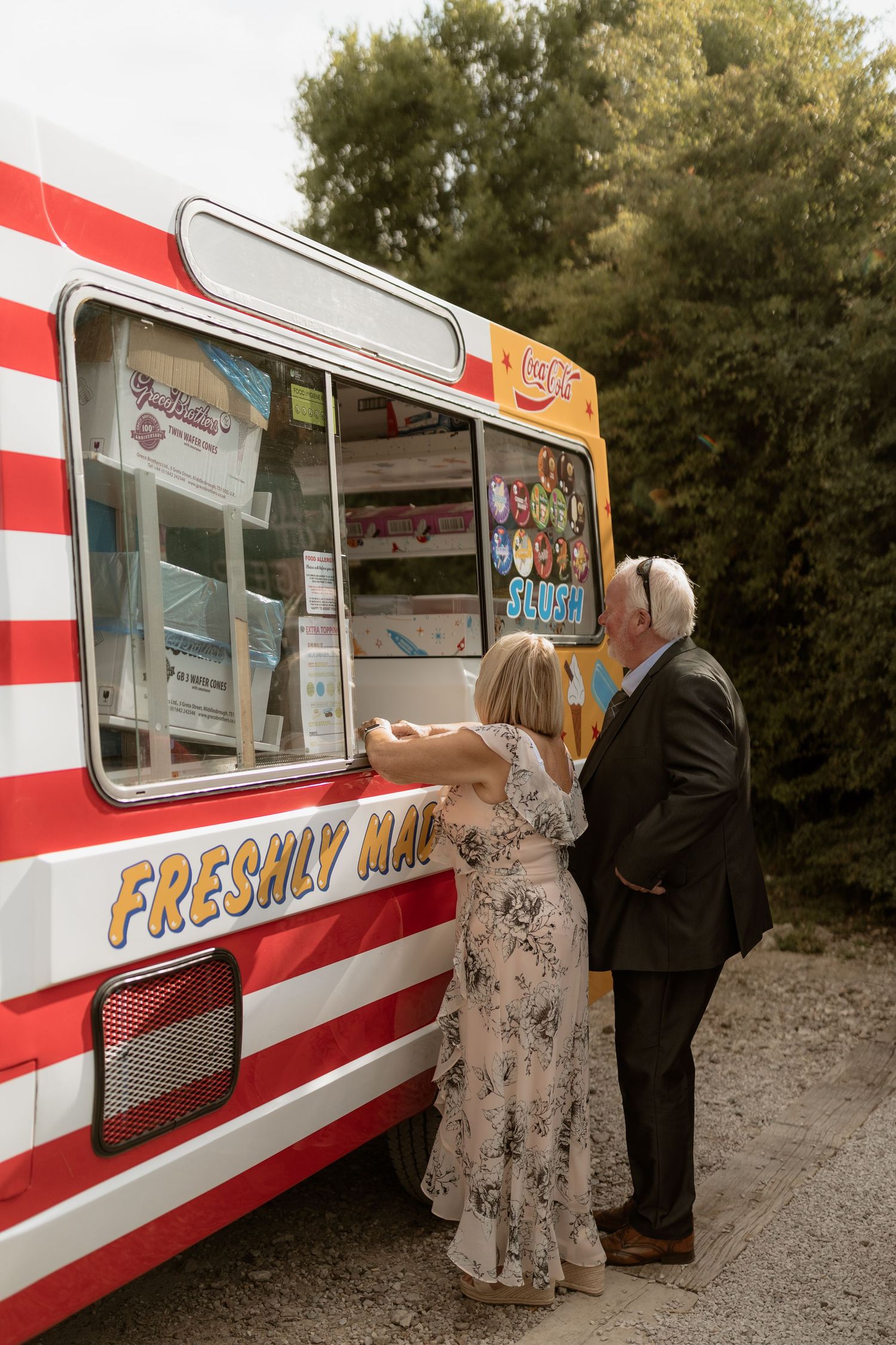 Three sequential photos show customers ordering from a red and white striped food truck parked on gravel near trees.