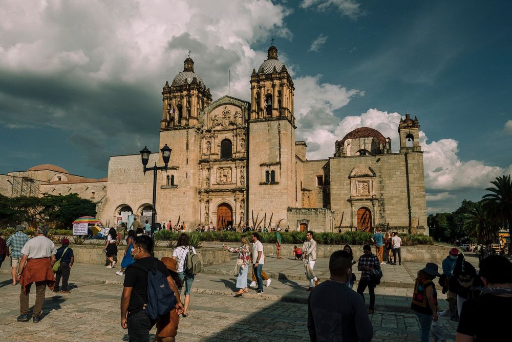 Historic church at Santo Domingo de Guzman against dramatic clouds in the Mexican state of Oaxaca.