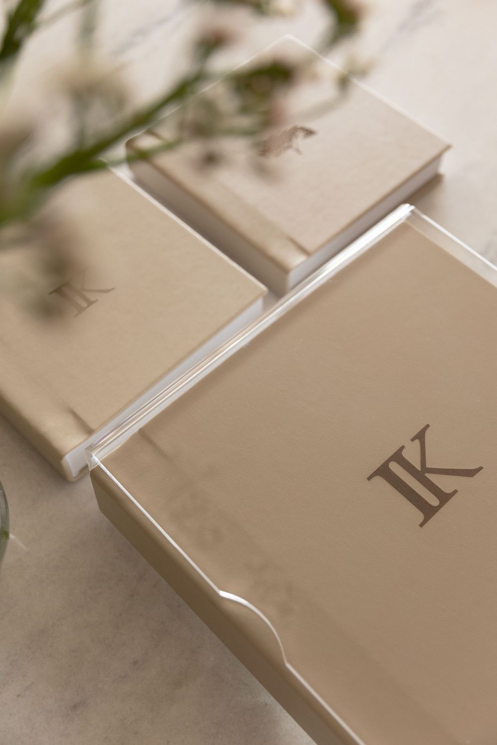 Elegant cream-colored photography packaging with monogram LK branding.