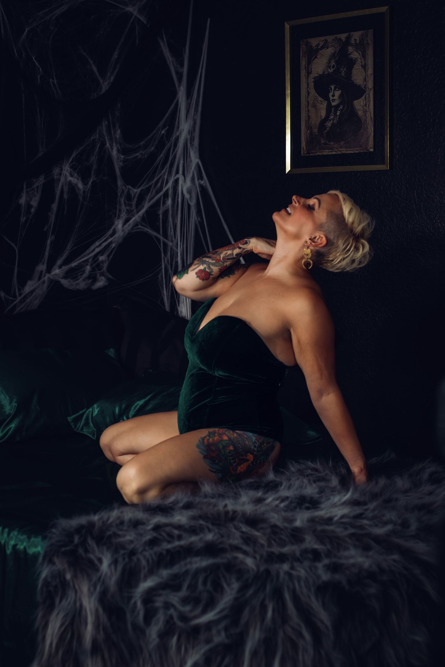 Client with tattoos and unique style posing in a Fort Worth boudoir session, with an emphasis on self-expression.