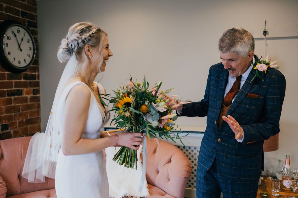 A collection of candid wedding photos showing special moments between couples during an intimate indoor ceremony.
