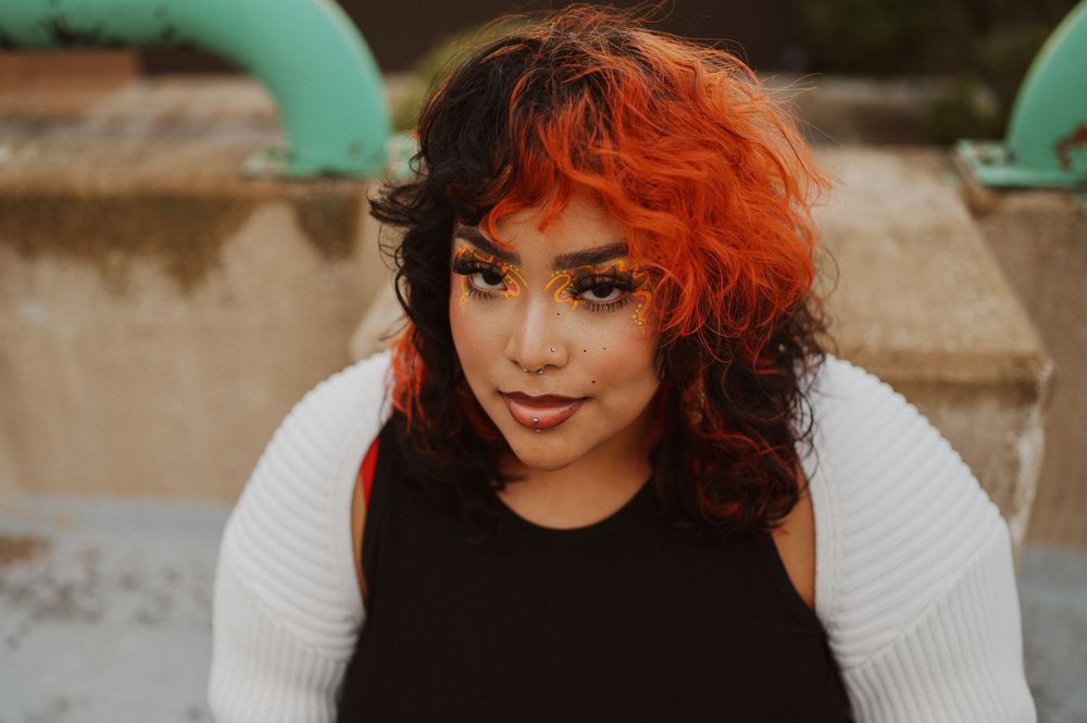 A series of close-up portrait shots showing vibrant red-orange hair and white sweater against a neutral background.