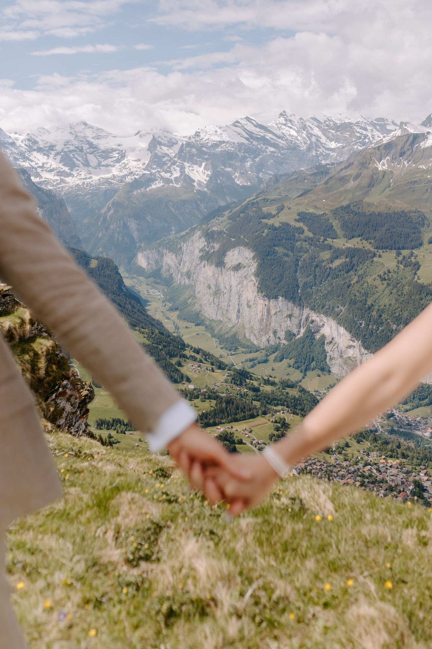A beautiful mountain landscape with snow-capped peaks and green valleys in the Swiss Alps.