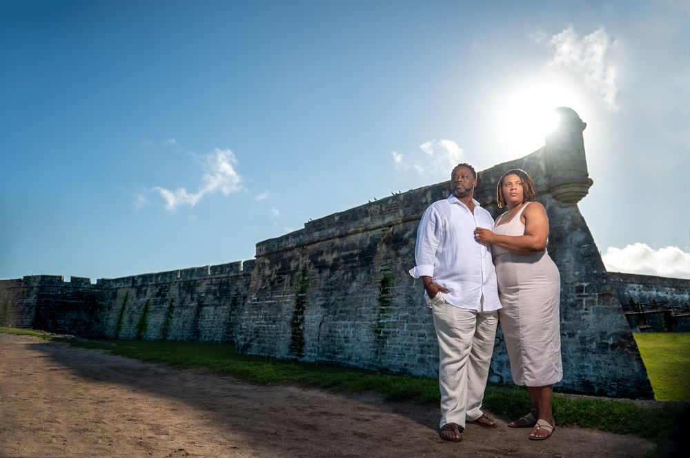 Engagement session overlooking the bay at Castillo de San Marcos, captured by wedding photographers in South Florida.