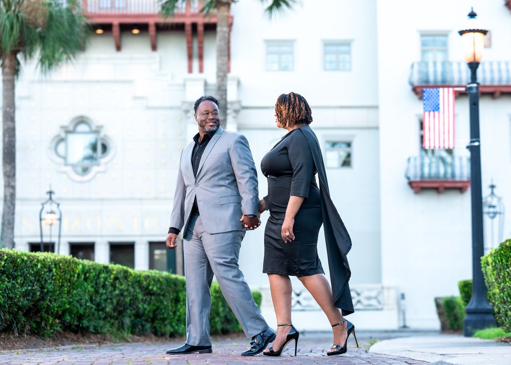Romantic portrait beside the reflecting pool at the Lightner Museum, taken by South Florida wedding photographers.