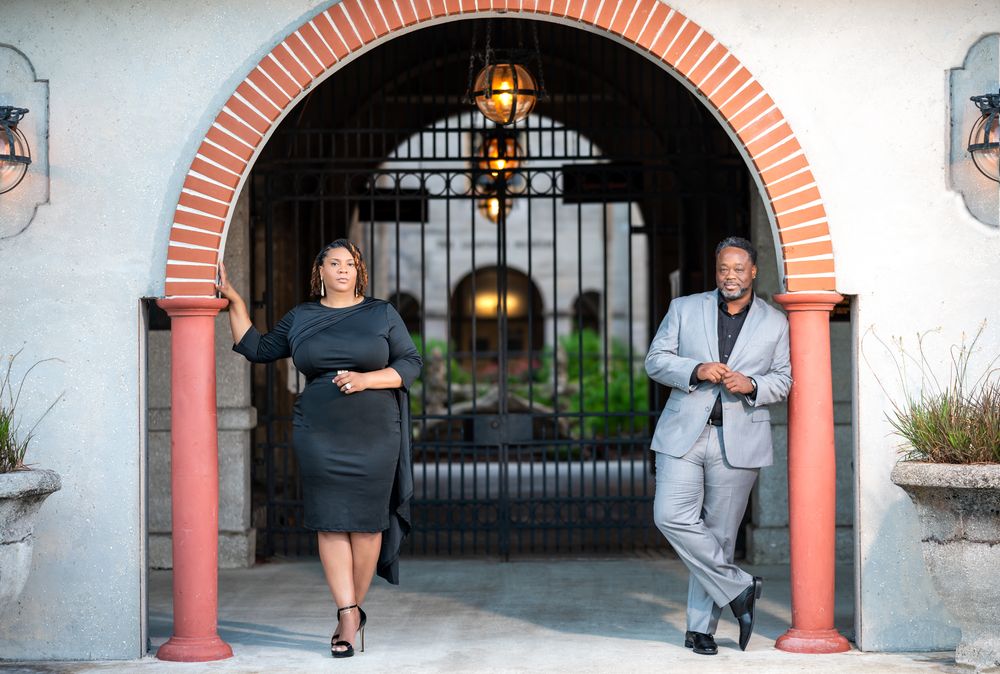 Close-up of the couple smiling in front of the Lightner Museum’s historic architecture, styled by Florida wedding photographers.