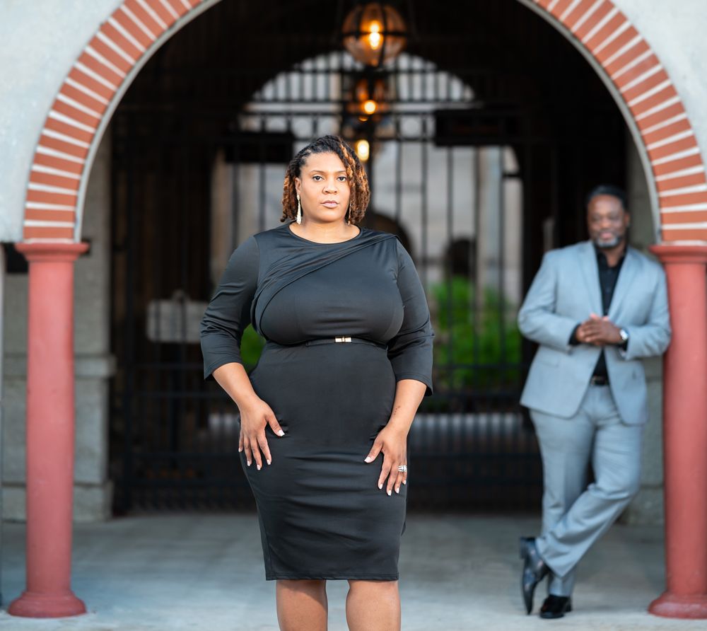 Engagement session under the arched walkways of the Lightner Museum, photographed by Palm Beach wedding photographers.