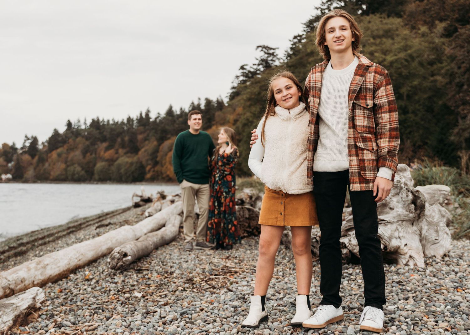 A collage of coastal family photos showing rocky beach scenes and casual autumn outfits in muted earthy tones.