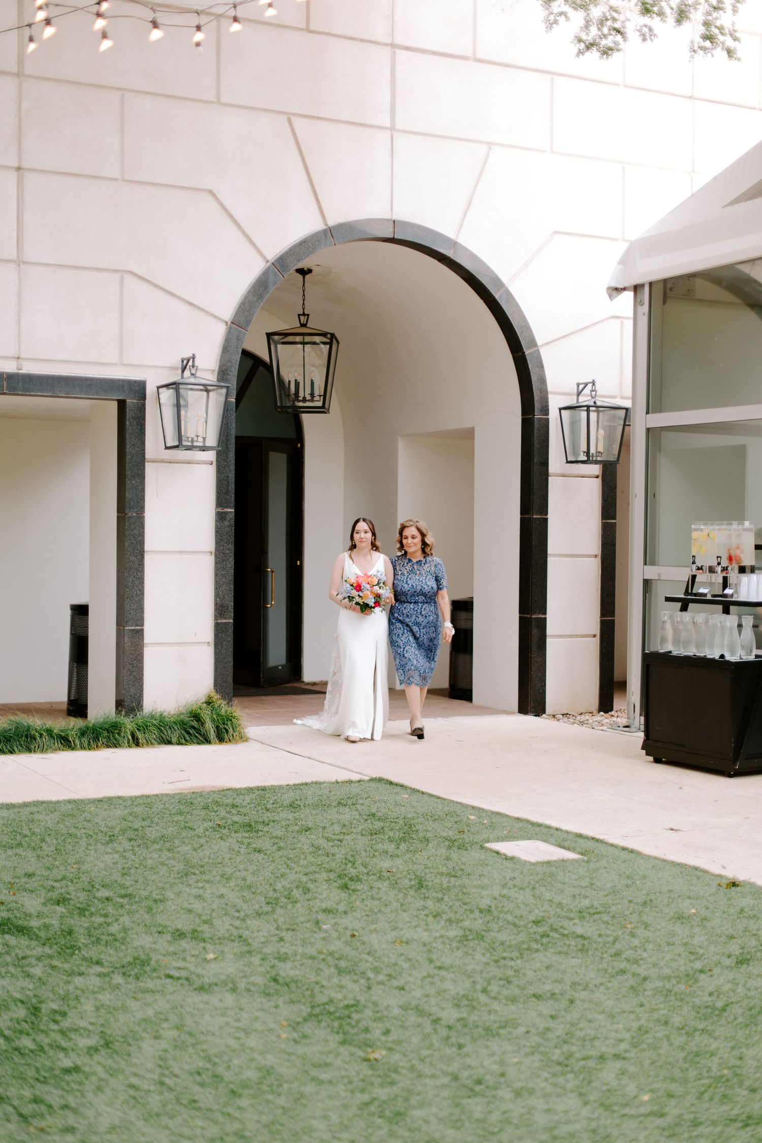 A sequence of photos showing a white arched corridor and courtyard with green lawn area at an outdoor venue.