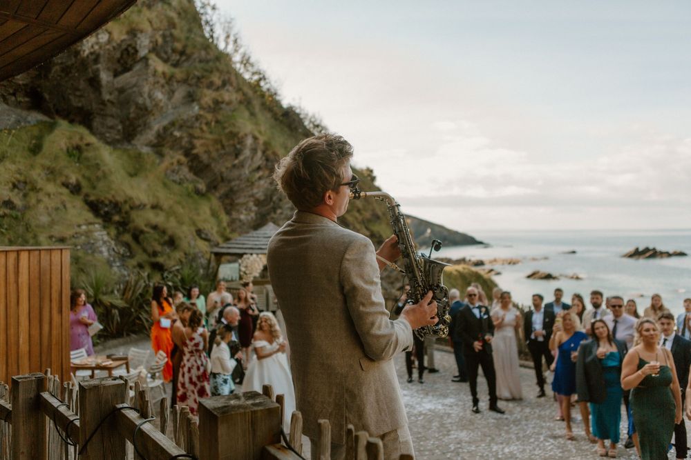 Saxophonist Dan Costin performing at Tunnels Beaches wedding
