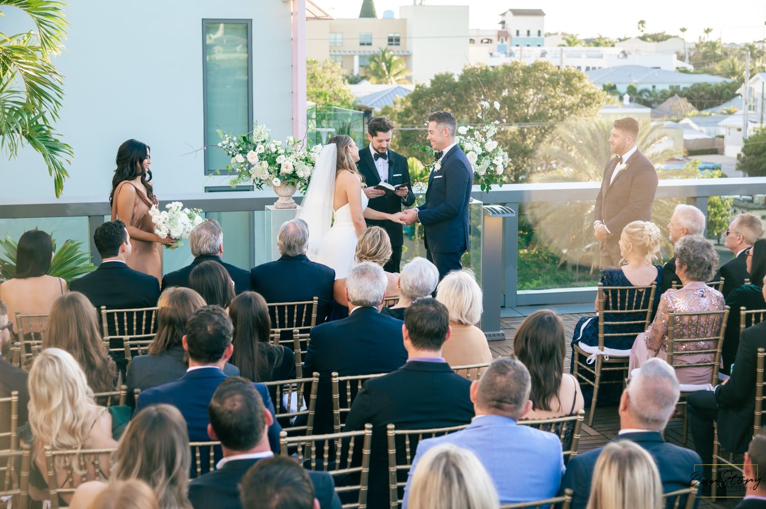 Bride and groom dancing beneath string lights at a Delray wedding venue captured by Delray wedding photographers.
