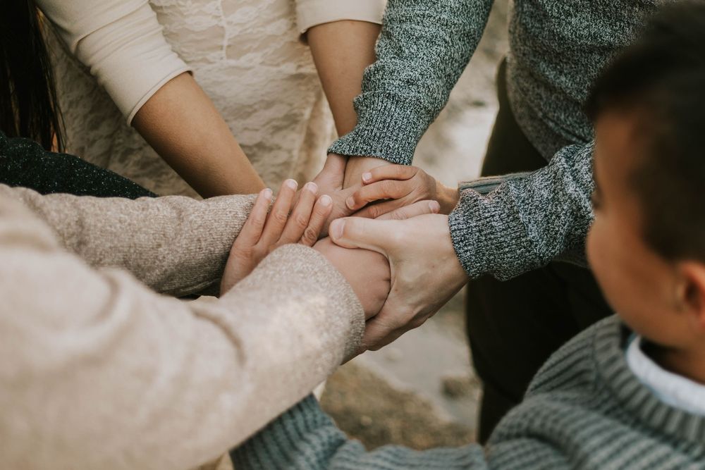 Parksville photography portrait of family hands detail shot at Madrona Point Beach Vancouver Island during sunset photoshoot