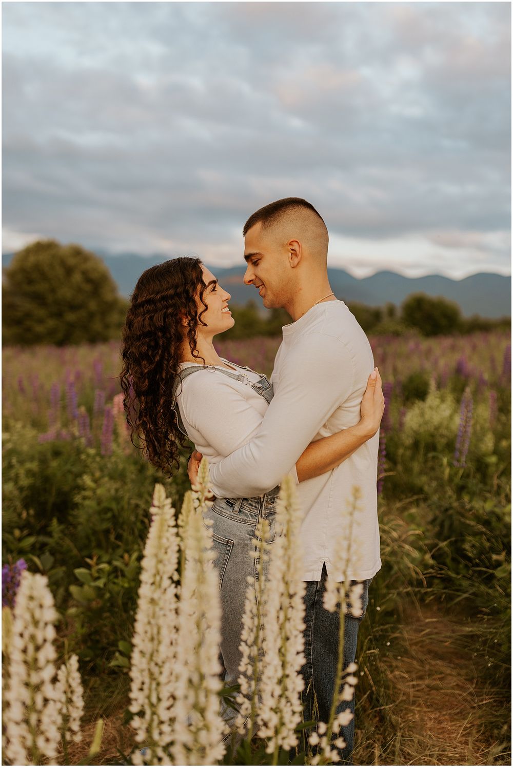 A couple taking engagement photos in New Hampshire